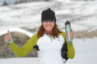 TAP co-founder Chris Mackay with her reusable water bottle. Photo: TAP.